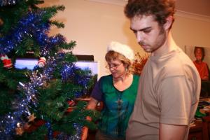 Alison and aidan decking out the christmas tree 2008 fs